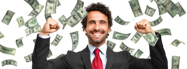 Happy man enjoying the rain of money